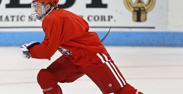 An image of a hockey player skating.